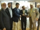 Azhar Javed Acting President PPCUK receiving conference memento